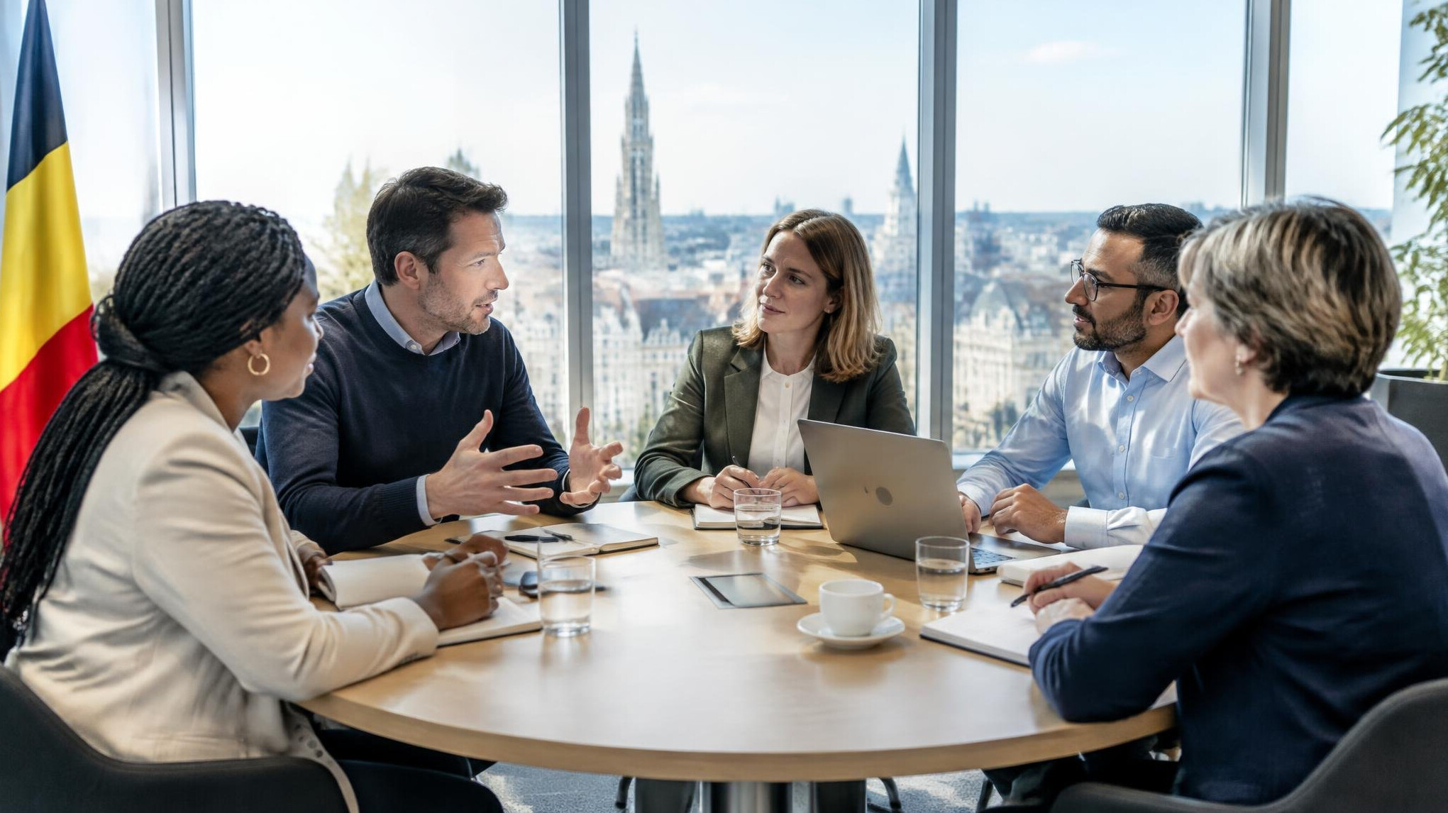 Team of professionals meeting around a table in Brussels office